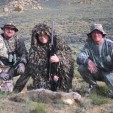 Cory Lundberg (left) along with Aaron Carter of the NRA and Mike Nischalke of Texas with a Wyoming 'yote Carter put on the ground. Hunting with multiple people can be a plus since you'll have extra eyeballs scanning the terrain. (Photo: Alan Clemons)