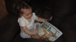 Baby reading deer and deer hunting magazine