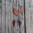 Earrings made from deer hide and gem stones.