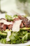 Venison Loin with Arugula is easy to prepare and delicious with a light vinaigrette dressing. (Photo: Stacy Harris, www.GameandGarden.com)
