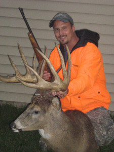 Johnny King with a mount of his buck
