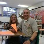 Father and daughter in the same class? Tom Schneider gets ready to sail a paper airplane.