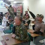 These camo-clad students can barely fit into their desks!