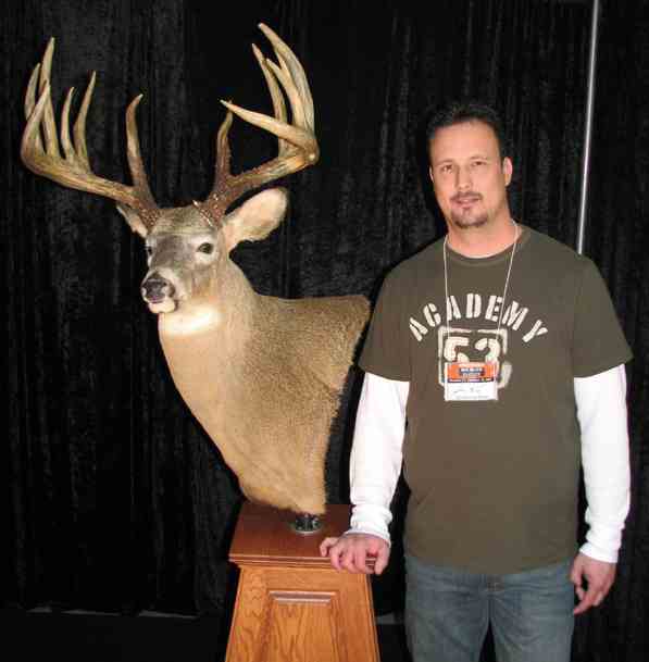 Johnny King with his massive white-tailed deer, which has been scored and officially deemed the world record by the Northeast Big Buck Club. (Photo: www.whitetailworld.com)