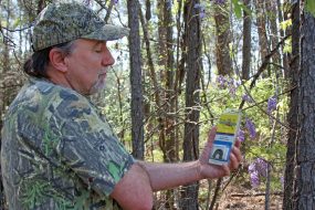 Veteran turkey hunter Larry Norton of Alabama shows off a Ben Lee turkey call found on eBay, a rare find. (PHOTO: David Rainer, Alabama DCNR)