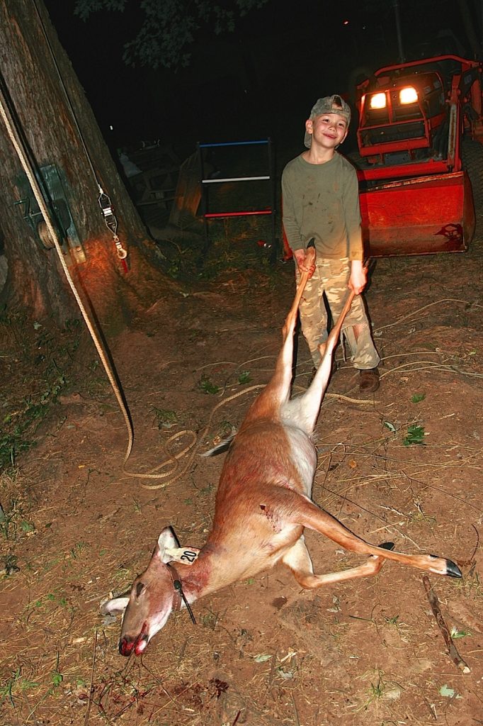 Although Paul Thoburn had many questions about his unusual deer, he was happy to help with the big hunting chores that include skinning and processing.